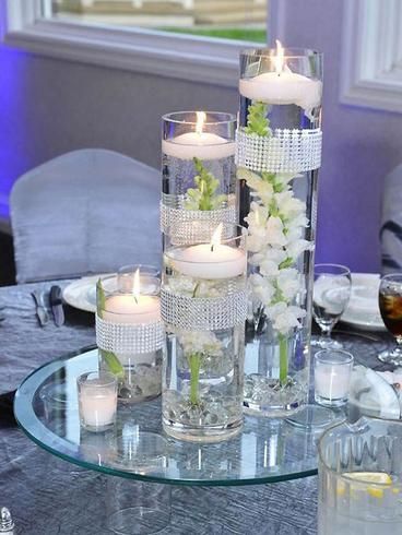 a table with candles and flowers on it