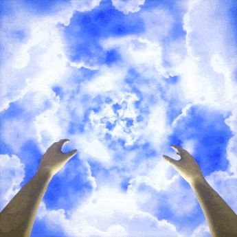 two hands reaching up into the sky with clouds in the backgrounds