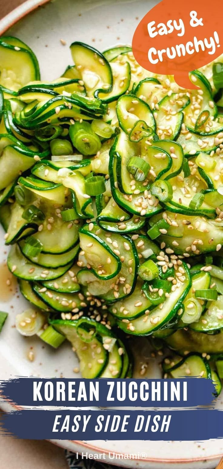 a white plate topped with cucumbers and sesame seeds