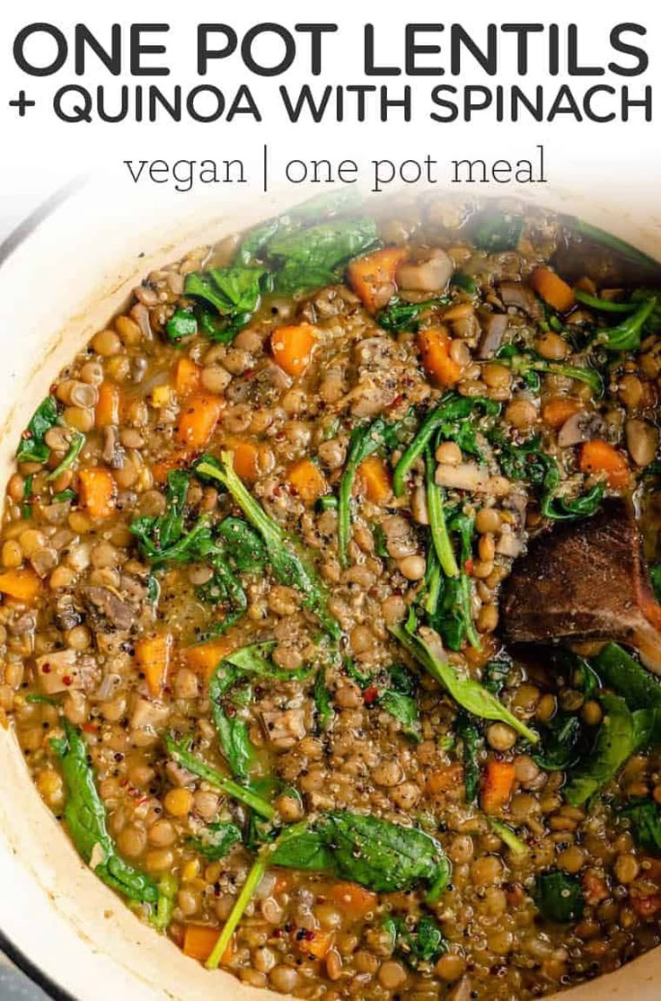 one pot lentils and quinoa with spinach in a white dutch oven