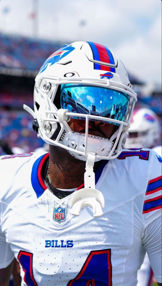 a close up of a football player wearing a helmet