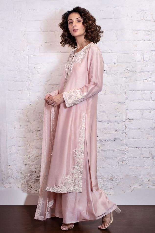 Blush pink straight kurta with sequin and thread embroidery in floral pattern. Paired with a pant and dupatta.
Components: 3
Pattern: Embroidered
Type Of Work: Resham, Dori, Sequin
Neckline: Round
Sleeve Type: Long
Fabric: Kurta and Pant: Silk, Pant: Silk Organza
Color: Pink
Other Details: 
Length:
Kurta: 47 inches
Pant: 43 inches
Occasion: Mehendi and Haldi - Aza Fashions Semi-stitched Dabka Pant Set For Wedding, Raw Silk Pant Set With Zari Work For Wedding, Wedding Pant Set With Zari Work In Raw Silk, Wedding Pant Set In Raw Silk With Zari Work, Chanderi Resham Embroidery Pant Set For Wedding, Wedding Pant Set With Resham Embroidery In Chanderi, Wedding Pant Set With Dabka On Straight Kurta, Dabka Palazzo Set For Reception, Wedding Pant Set With Dabka Work For Diwali