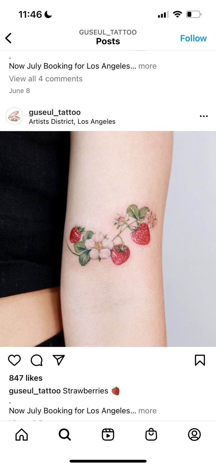 a small tattoo with strawberries on the arm