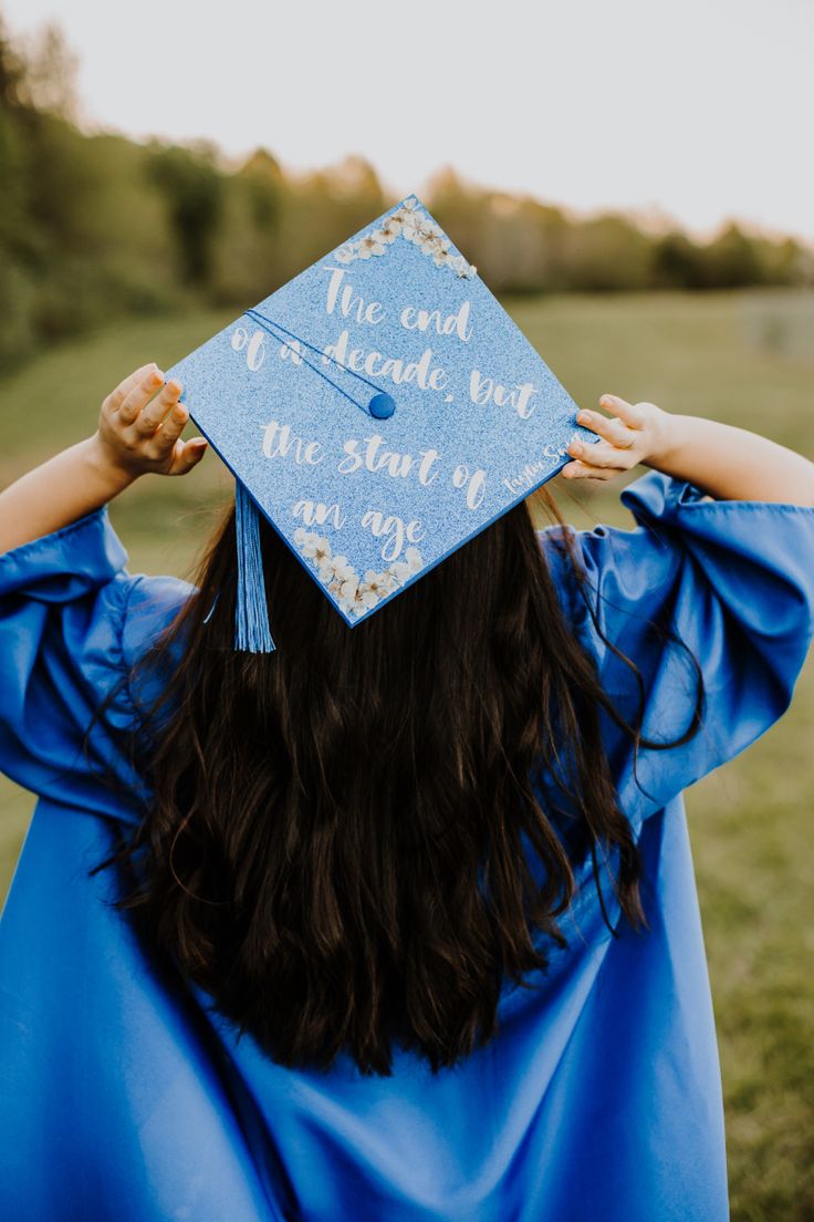 Picture of the back of girl (long, wavy, Black hair) and her cap that says “The end of a decade, but the start of an age” Long Live Taylor Swift Graduation Cap, Taylor Swift Cap And Gown, College Grad Cap Ideas Taylor Swift, Graduation Cap Decoration Taylor Swift, High School Grad Cap Ideas Taylor Swift, Taylor Swift Inspired Graduation Caps, Graduation Caps Taylor Swift, Grad Cap Designs Taylor Swift, Taylor Graduation Cap