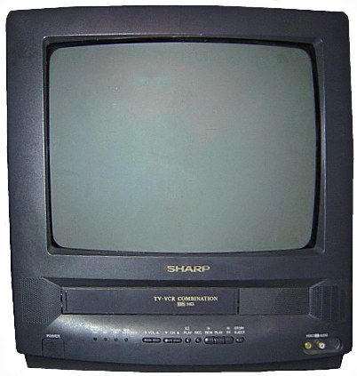 an old black television sitting on top of a table