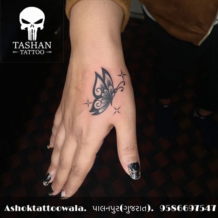 a woman's hand with a butterfly tattoo on her left wrist and the words, tattoevana