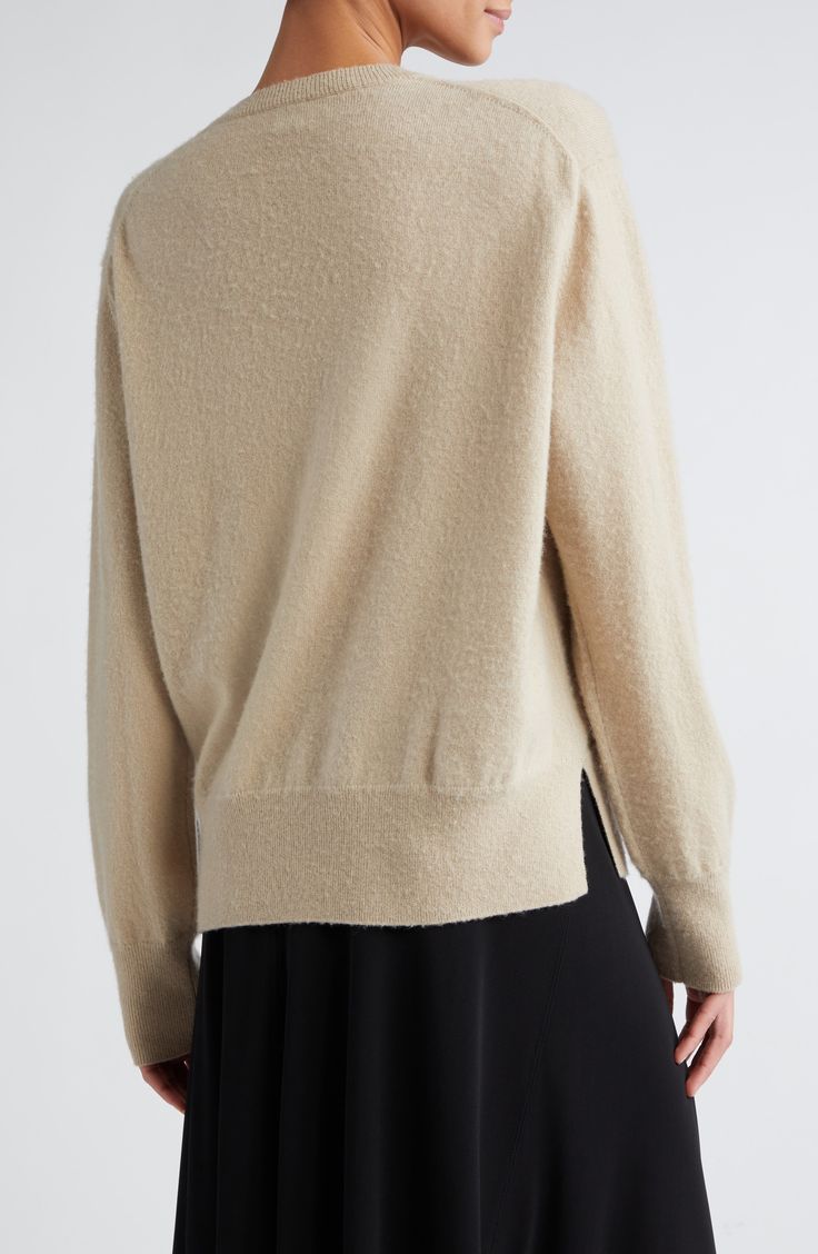 The brand's signature blending of texture and shape is put to its casual, comfortable best use on this roomy cashmere sweater. A tonal logo is subtly embroidered at one cuff. 26" length (size Medium) Crewneck Long sleeves Dropped shoulders Ribbed cuffs and hem Side slits 100% cashmere Hand wash, dry flat Imported Designer Clothing Oversized Elegant Cashmere Sweater, Luxury Beige Sweater For Fall, Classic Sweater With Soft Texture, Luxury Fine Knit Sweater For Fall, Luxury Fine Knit Fall Sweater, Luxury Beige Sweater For Workwear, Luxury Beige Sweater For Work, Elegant Sweater In Soft Knit With Relaxed Fit, Elegant Soft Knit Sweater With Relaxed Fit