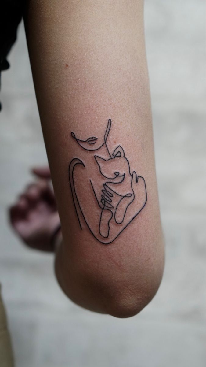 a person with a tattoo on their arm