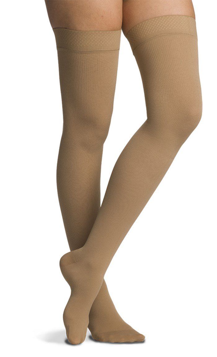 The Sigvaris® Women's Cotton Thigh Highs offer a stylish look in a firm grade compression sock. Perfect for the office, going out, and everyday wear, you can keep your legs healthy and comfortable in fashion. Designed with breathable and durable construction, these knee highs also offer 100% Supima® Cotton that provides all day softness and comfort. Closed Toe 100% of Supima® Cotton lies against the skin to ensure comfort Breathable and durable Classic ribbed look Ideal for everyday wear and for Socks Over Leggings Outfit, Socks Over Leggings, Stockings For Women, Socks Outfit, Compression Stockings, Sock Outfits, Compression Garment, Over The Knee Socks, Thigh High Socks