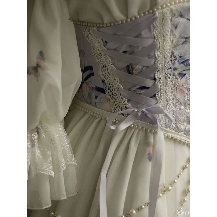 An embroidered corset with a lily flower, which symbolizes purity, drawn in the brushstrokes. The embroidered lace, braided ribbon, and chain of pearls give it an elegant and glamorous look. The sparkling beauty catches your eye. A beautiful muse with a modest presence. 
 
 Size 
 
 S size 
 
 Waist: 60-72cm 
 
 M size 
 
 Waist: 70-82cm 
 
 L size 
 
 Waist: 78-90cm 
 
 
 
 
 
 
 
 
 
 
 
 
 
 Material  
 
 Polyester 
 
 
 Model worn 
 
 Wearing size 
 
 S size 
 
 Model dimensions 
 
 Height: Elegant White Lace Bodice, Elegant Lace Bodice With Corset Back, Elegant Lace Bodice With Sweetheart Neckline, Elegant Underbust Corset With Lace Trim, Elegant White Tulle Bodice, Elegant Lace Underbust Corset, Elegant Lace Corset, Elegant Lace Overbust Bodice, Elegant Fitted Lace Trim Bodice