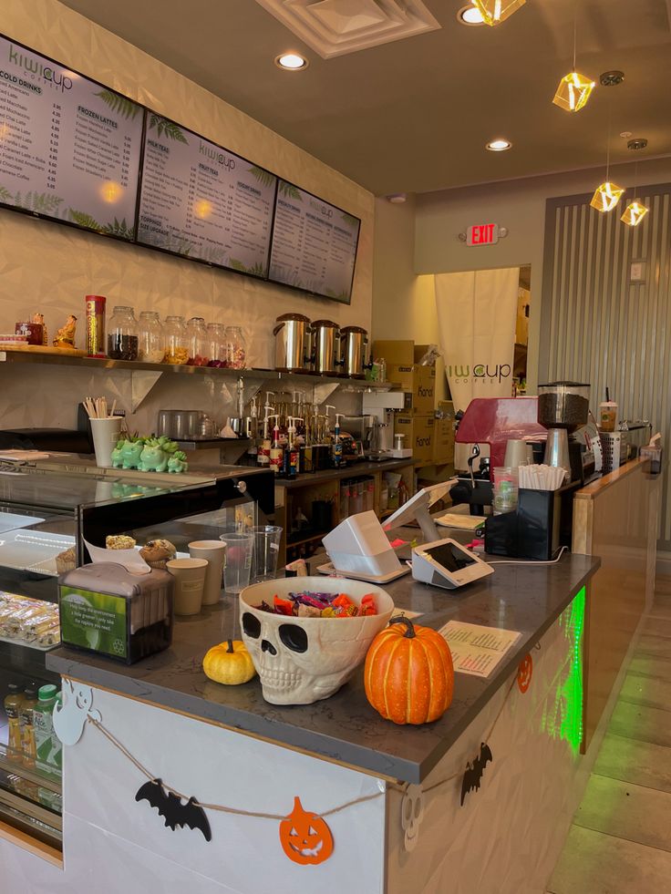 a counter in a restaurant with halloween decorations on it