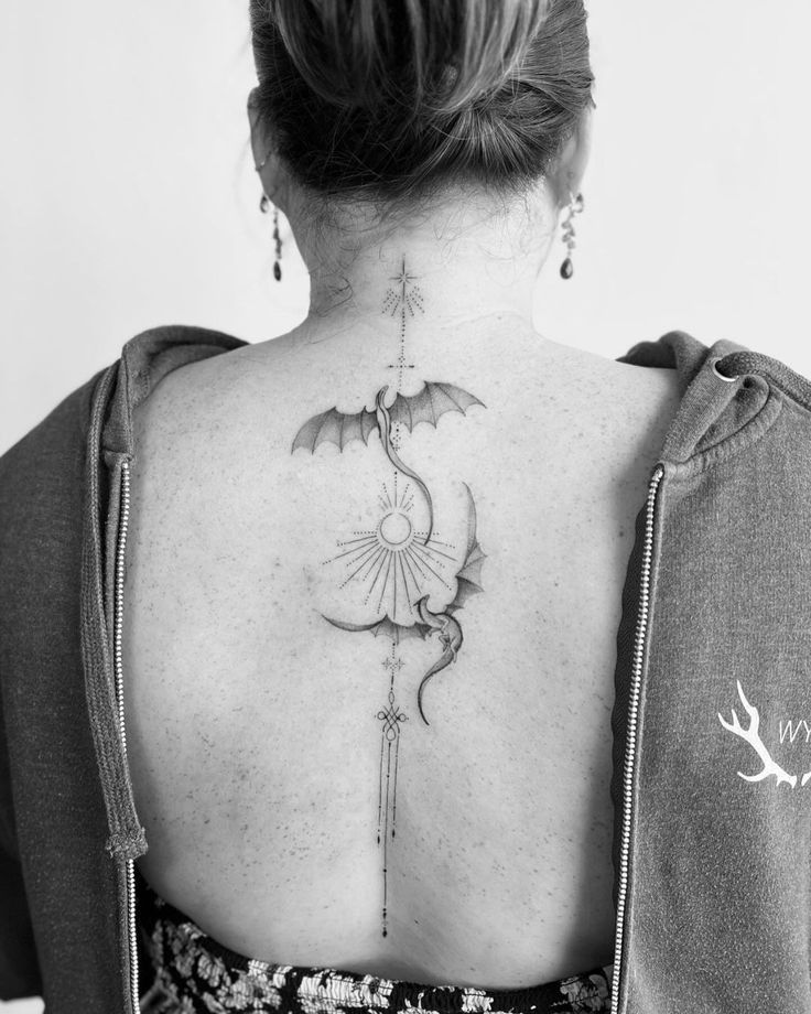 a woman with a tattoo on her back