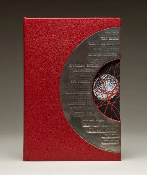 a red book with an intricate design on the cover