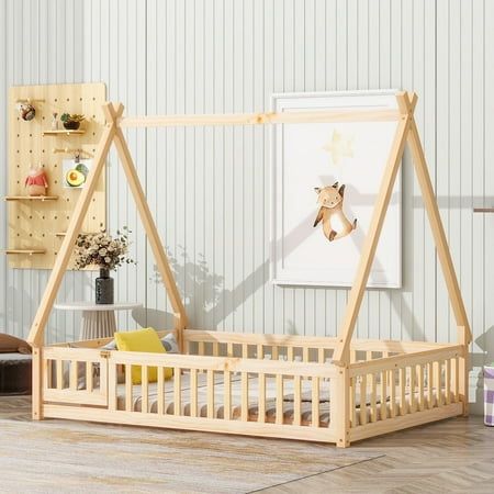 a child's bed with a wooden frame