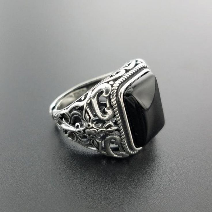 This square-shaped hollow carved punk ring made from real 925 sterling silver with natural black onyx stone. Specification: Brand Name: GQTorchStyle: Vintage, Fashion, Punk, RockGender: MenSize: Re-sizableItem Type: RingsRings Type: Cocktail RingColor: SilverStone: OnyxMaterial: MetalMetals Type: 925 Sterling SilverSetting Type: Tension MountSurface Width: 15mmOccasion: Party Punk Jewelry, Black Onyx Stone, Black Onyx Ring, Mens Silver Rings, Viking Jewelry, Onyx Ring, Onyx Stone, Garnet Rings, Sea Glass Jewelry