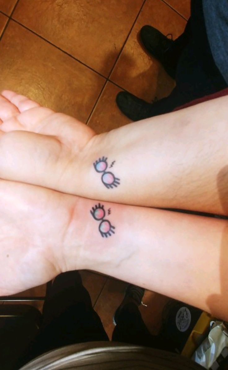 two people with matching tattoos on their legs