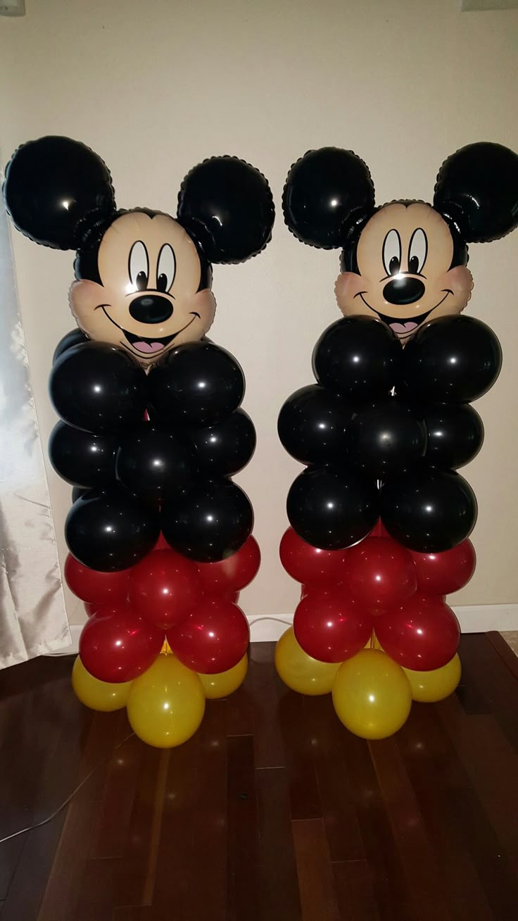 mickey and minnie mouse balloons on the floor