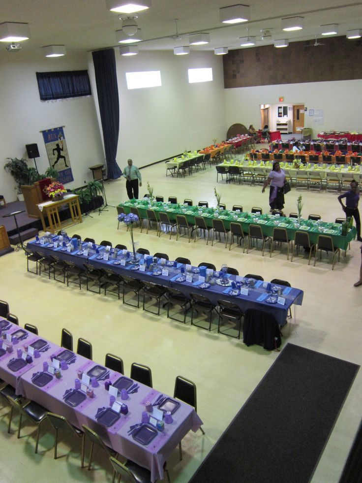 a large room with tables and chairs set up for an event