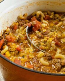 a large pot filled with pasta and meat