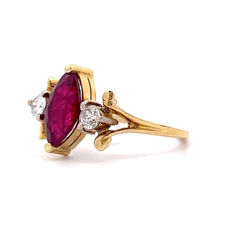 This stunning ruby engagement ring features a 1.67 carat marquise cut red ruby and diamond accents in 18 karat yellow gold. Modern and timeless in design. The ruby has a high saturation of color. Burgundy red and eye-catching. Two (2) .10 carat near colorless diamonds sparkle against the warm 18 karat yellow gold setting. Shop more Engagement Rings. Classic Ruby Ring With Marquise Cut And Prong Setting, Marquise Ruby Ring With Center Stone, Marquise Cut Ruby Diamond Ring, Classic Marquise Red Diamond Ring, Gold Ruby Marquise Ring With Center Stone, Heirloom Marquise Ruby Ring With Center Stone, Formal Ruby Marquise Cut Ring, Red Marquise Cut Diamond Ring, Formal Marquise Ruby Ring With Accent Stones