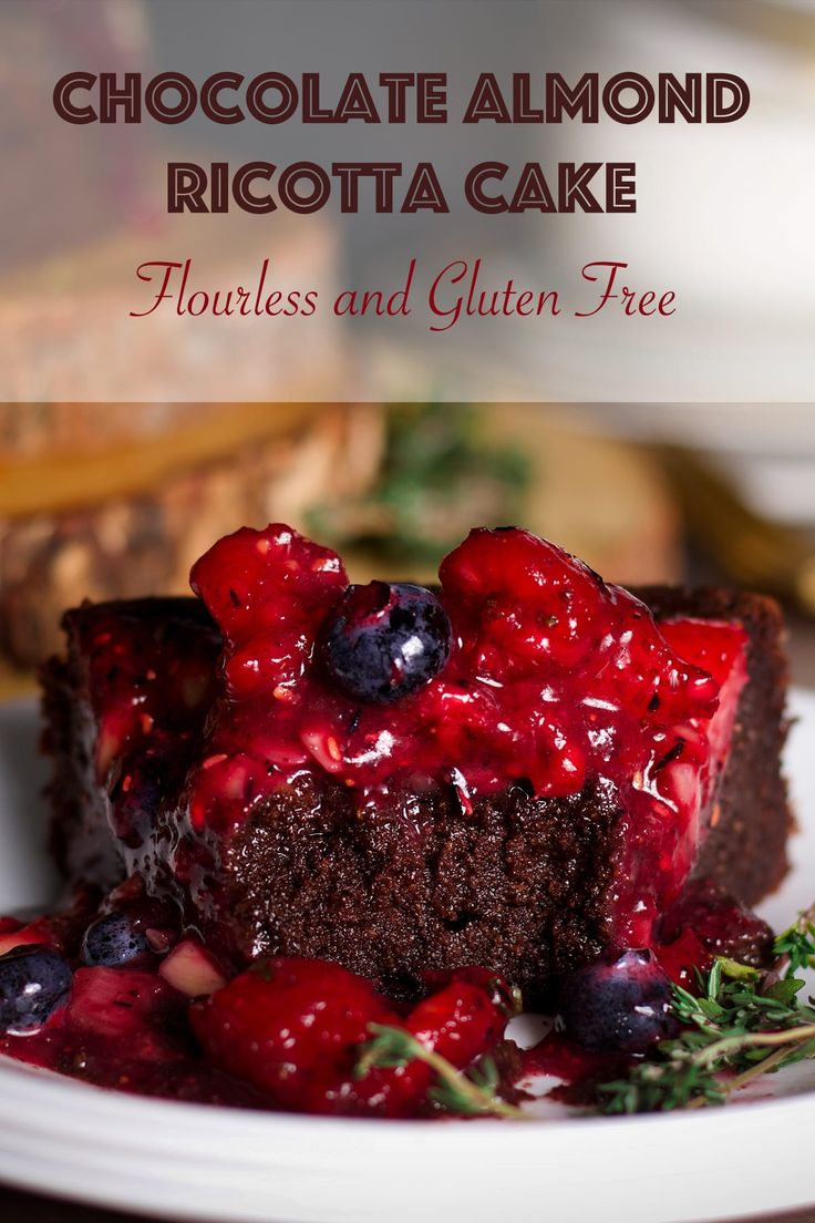 chocolate almond ricotta cake on a plate with berries