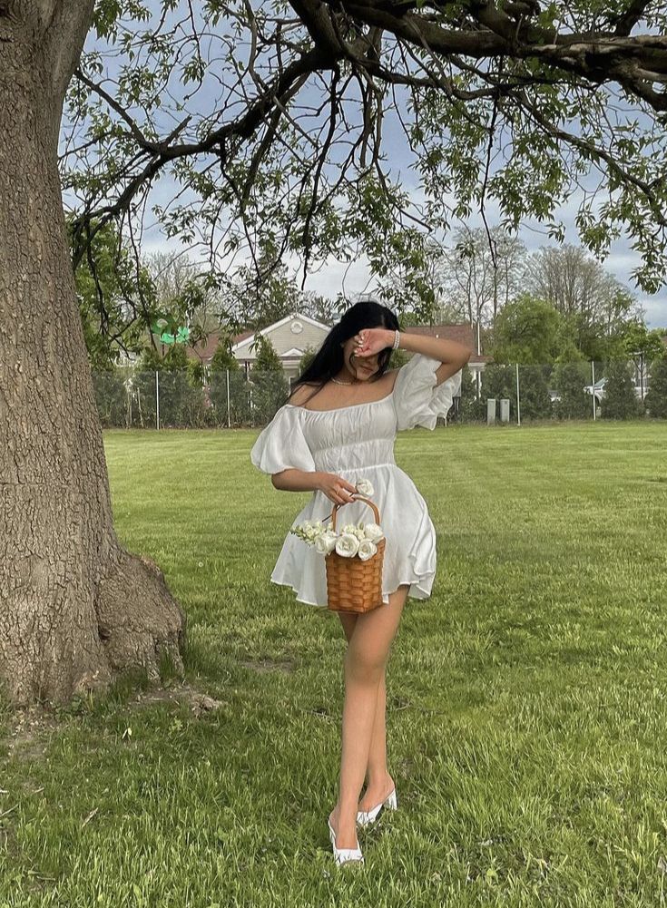 A girl holding a basket of flowers wearing a white mini dress. Cottage Core Dress Aesthetic, White Cottage Core Dress, Sundress Aesthetic, Disney Poses, Cottage Core Dresses, Modest Girly Outfits, Cute Photo Poses, Photos For Instagram, Cute Pose