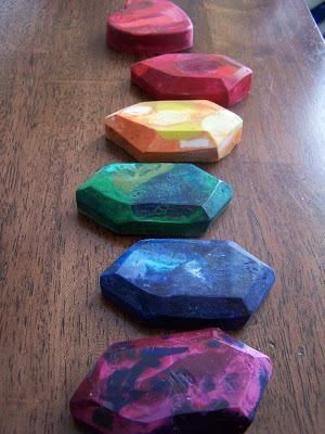 colorful rocks lined up on a wooden table