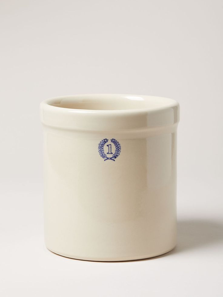 a white container with a blue logo on the front and bottom, sitting against a white background