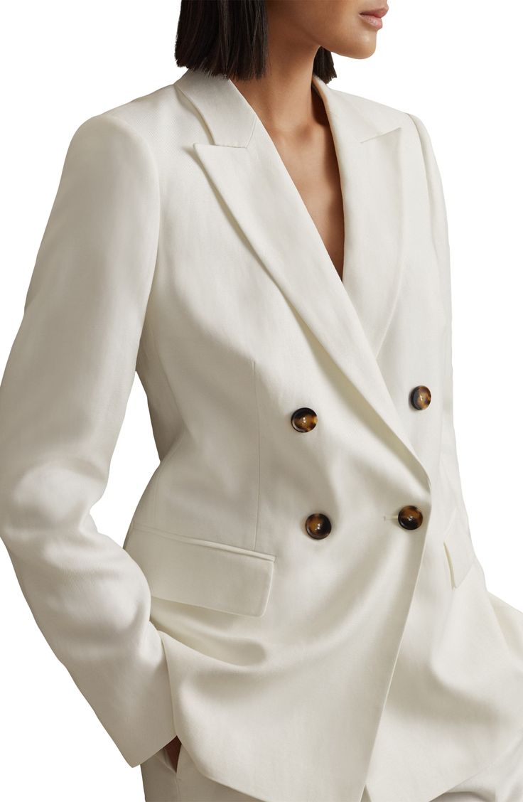 Double-breasted tailoring defines a lightly structured longline blazer that's destined for the executive suite. 28" length (size 8) Double-breasted button closure Peaked lapels Button cuffs Front flap pockets Back vent Lined 74% viscose, 26% linen Spot clean Made in Turkey Queen Lifestyle, Linen Jackets Women, Ivory Blazer, Reiss Women, Cream Suit, Satin Blazer, Modern Clothing, Linen Jacket, Long Blazer