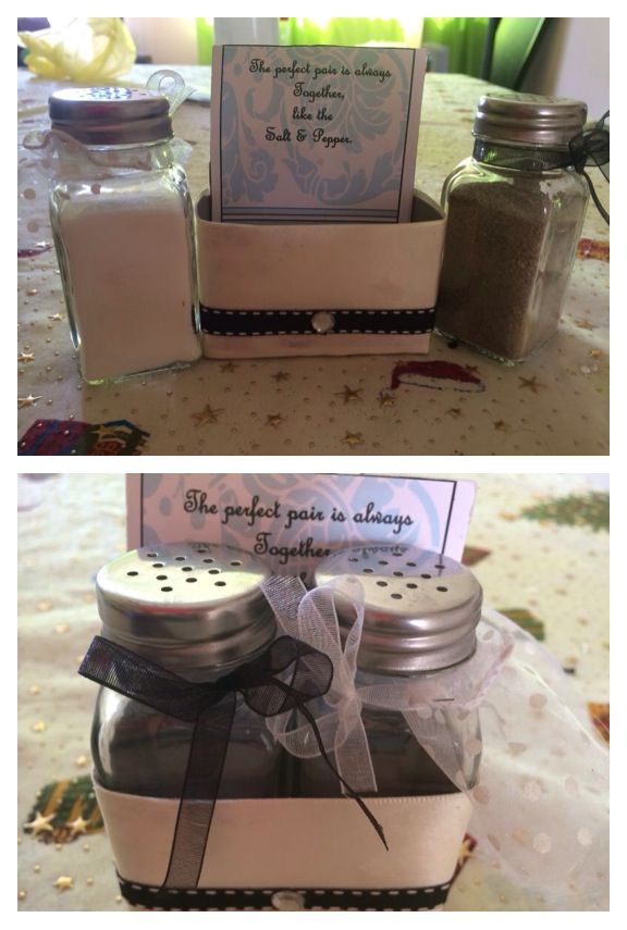 two jars filled with different items on top of a table