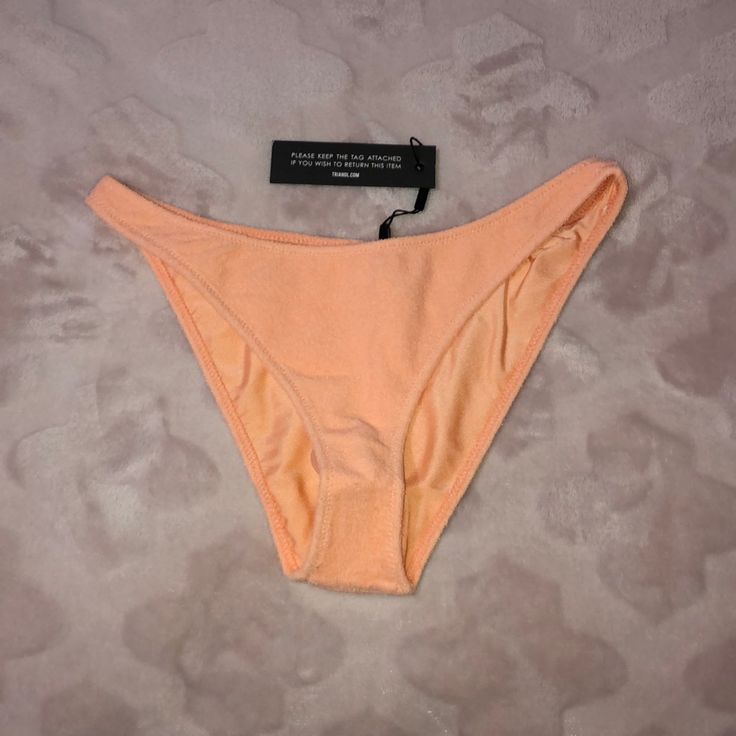 - Brand New With Tags, With Hygienic Liner, Never Worn - Authentic From Triangl - Size Xl Cheeky Bottoms But Runs Small - Peche Terry Material Pink Seamless Bottoms For Sunbathing, Peach Stretch Swimwear For Spring, Seamless Summer Party Bottoms, Summer Beach Peach Bottoms, Seamless Swimwear For Spring Party, Seamless Party Swimwear For Spring, Peach Fitted Swimwear For Poolside, Fitted Peach Swimwear For Swimming, Fitted Peach Swimwear For The Beach