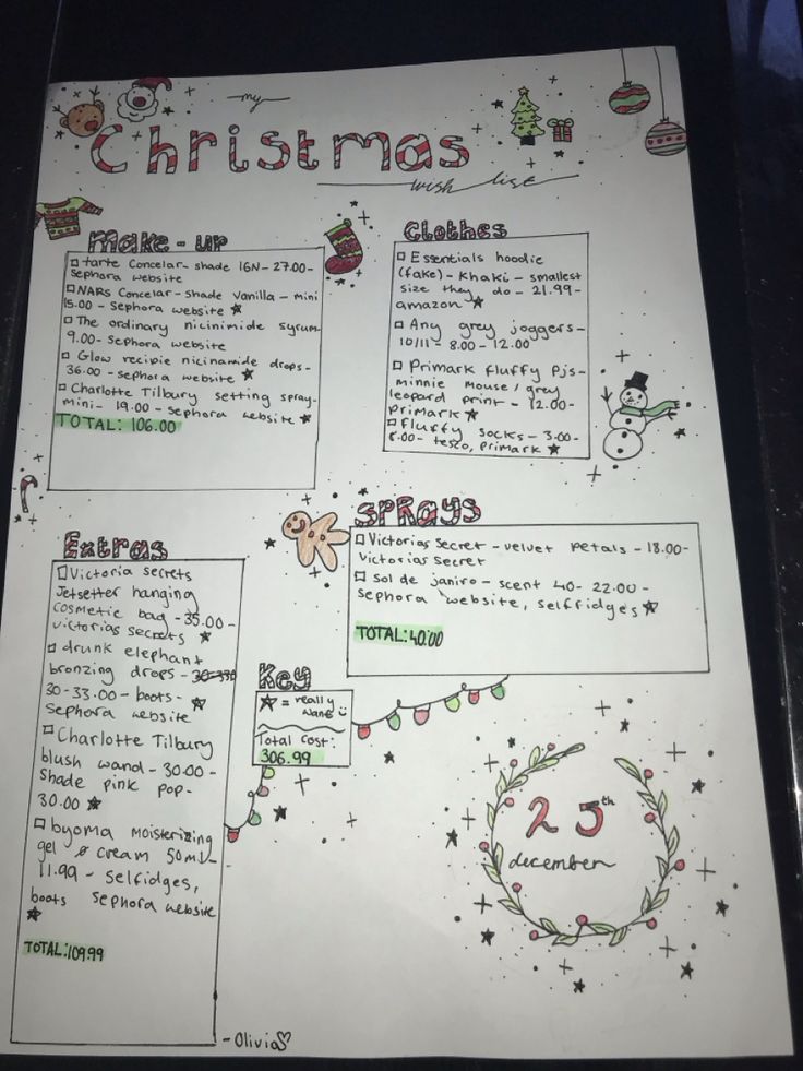 a christmas activity sheet is shown on a table with other writing and decorations around it