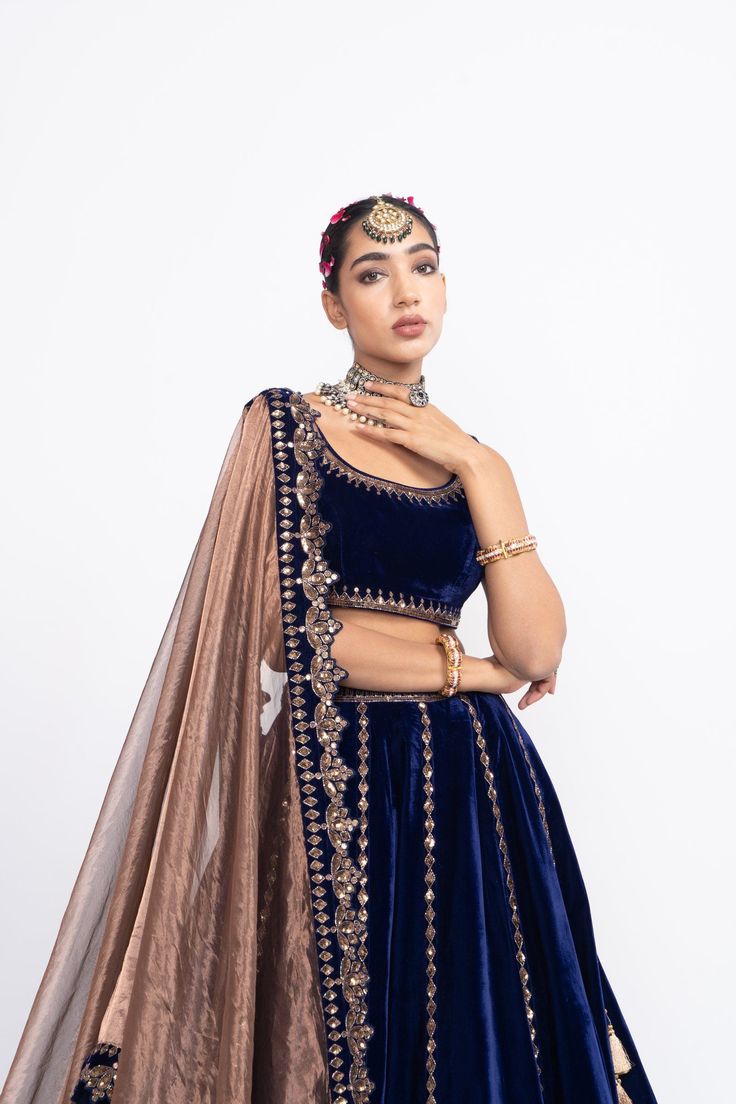 Navy blue without sleeve blouse paired with double tier lehnga and tissue dupatta.From Vvani Vats Mahnoor collection.DELIVERY TIMEPlease allow 8-12 weeks for your outfit to arrive.FABRIC DETAILSVelvet, TissueProfessional cleaning only. Lehenga Color Combinations, Royal Blue Lehenga, Navy Blue Lehenga, Tissue Dupatta, Vani Vats, Velvet Dupatta, Blue Color Combinations, Velvet Lehenga, Lehenga Designs Simple