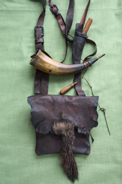 an animal's head and horns are attached to leather