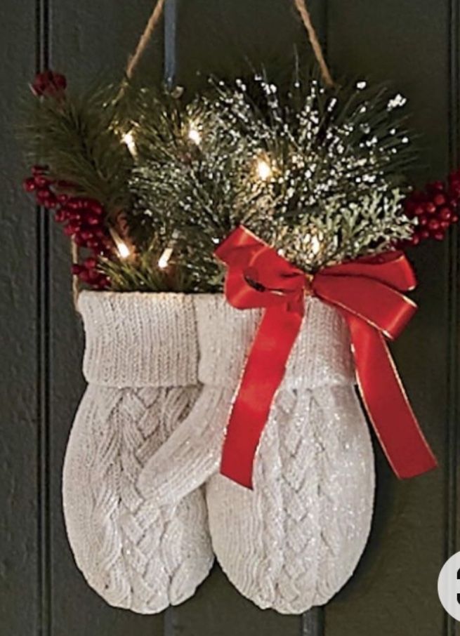 a pair of white socks hanging from the side of a door with lights on it