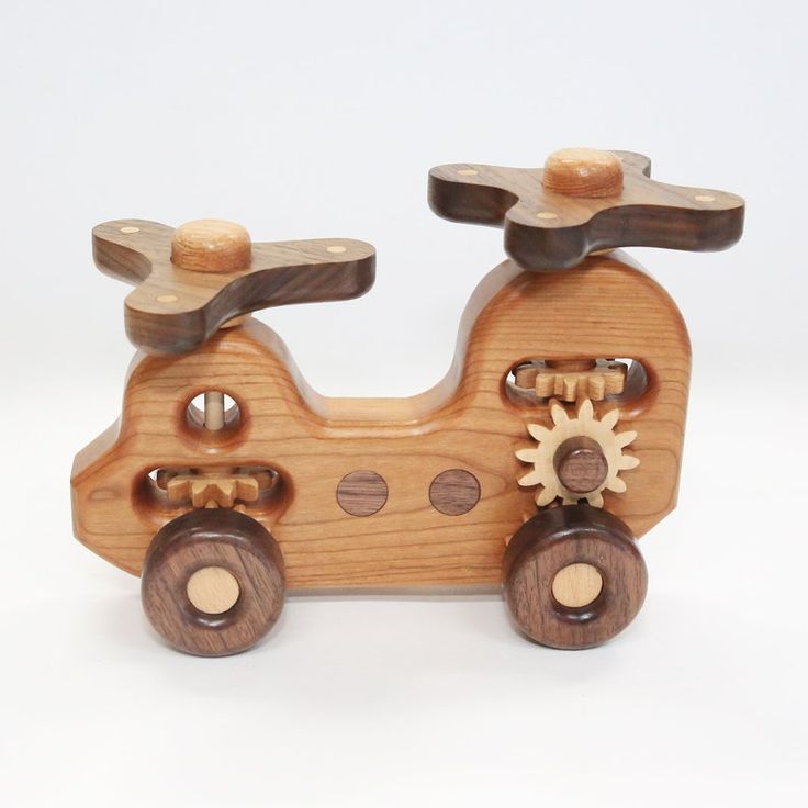 a wooden toy car with gears on the front