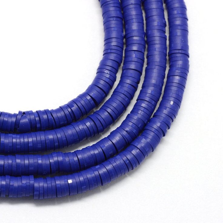 three blue round beads on a white background