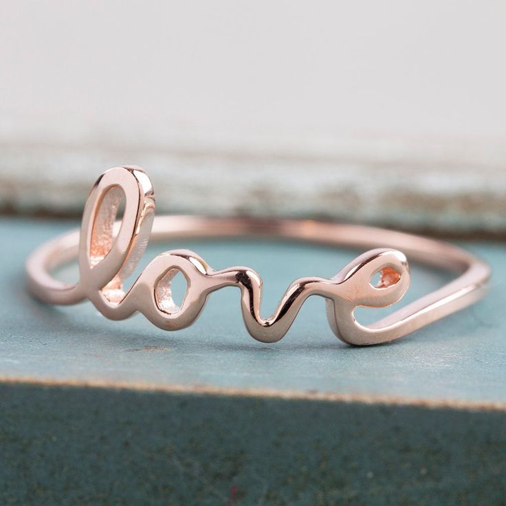 Script type love ring made with solid 14k gold. This ring is delicate, yet sturdy using solid 14k gold. Will make a perfect gift to express your love to someone very special to you. Each set will be sent in a charming gift box, ready for gifting. * Band width: ≈1.0mm * Solid 14k gold, rose gold, white gold * Made of 100% recycled precious metal * Comes in a gift box with a bow ready for gifting * Handmade with love and great care in New York *Please make sure you check the size using Ring Size G Love Ring Silver, Pink Morganite Engagement Ring, Morganite Engagement, Morganite Engagement Ring, Gold Halo, Cute Rings, Love Ring, Gold Engagement Rings, Womens Engagement Rings