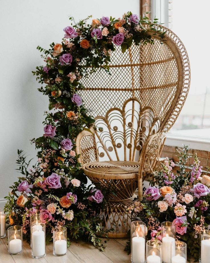 a wicker chair surrounded by candles and flowers