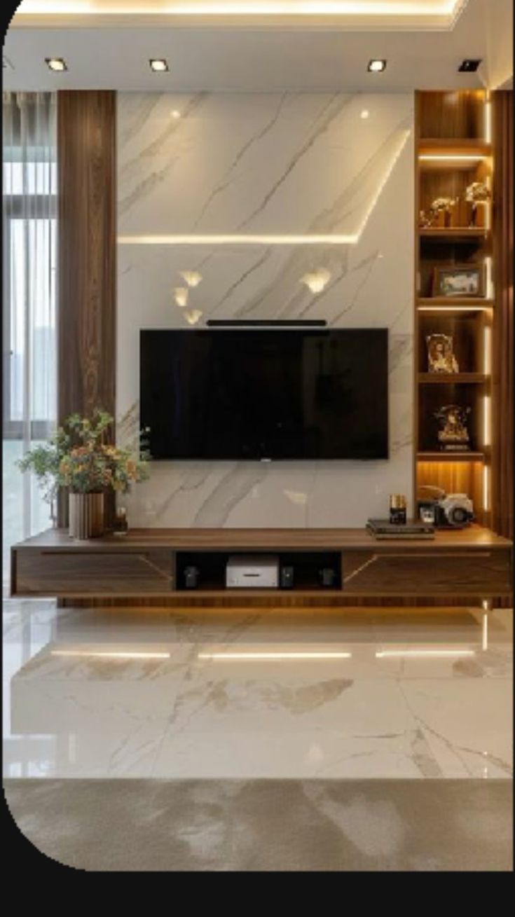 a living room with a large tv on the wall and shelves in front of it