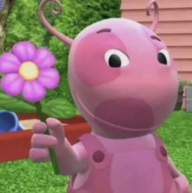 a cartoon character is standing in front of a flower