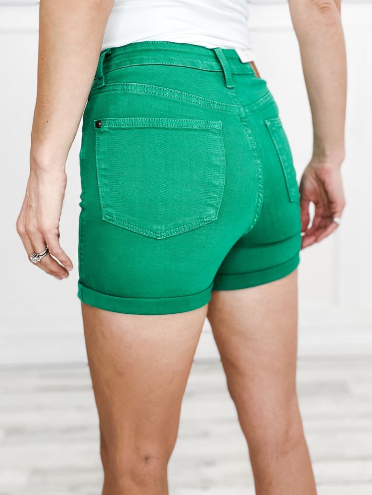 Meet your new favorite summer staple - the Judy Blue High Waist Tummy Control Kelly Green Garment Dyed Shorts. Designed with a high waist and tummy control technology, these shorts provide a flattering fit and added confidence. The vibrant kelly green color adds a pop of color to any outfit. Made from 91% Cotton, 7% Polyester, 2% Spandex FRONT RISE: 11, INSEAM: 4 / 6 (cuffed/ uncuffed) Small fits sizes: 2-4 Medium fits sizes: 6-8 Large fits sizes: 10-12 XL fits sizes: 13-15 1XL fits sizes: 14W-1 High Rise Cotton Bermuda Shorts For Summer, High Rise Cotton Shorts For Summer, Mid-rise Solid Shorts With Built-in Liner, Green Bermuda Shorts With Built-in Shorts For Summer, Summer Biker Shorts With Built-in Shorts, Stretch Solid Jean Shorts For Summer, Solid High-rise Jean Shorts For Summer, Spring Green Bermuda Shorts With Built-in Shorts, High Rise Solid Cotton Jean Shorts