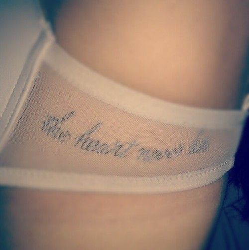 there is a woman with a tattoo on her stomach that says, the heart truth