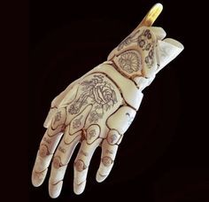 a hand that has tattoos on it