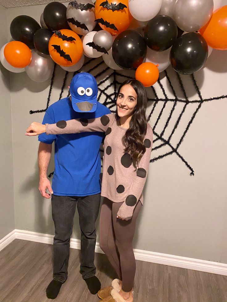 a man and woman dressed up in halloween costumes