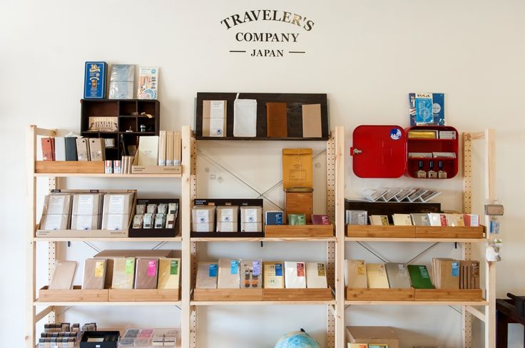 the shelves are full of books and other items in this store's display area