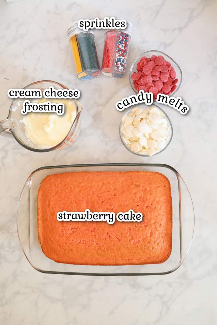 the ingredients for a strawberry cake on a counter