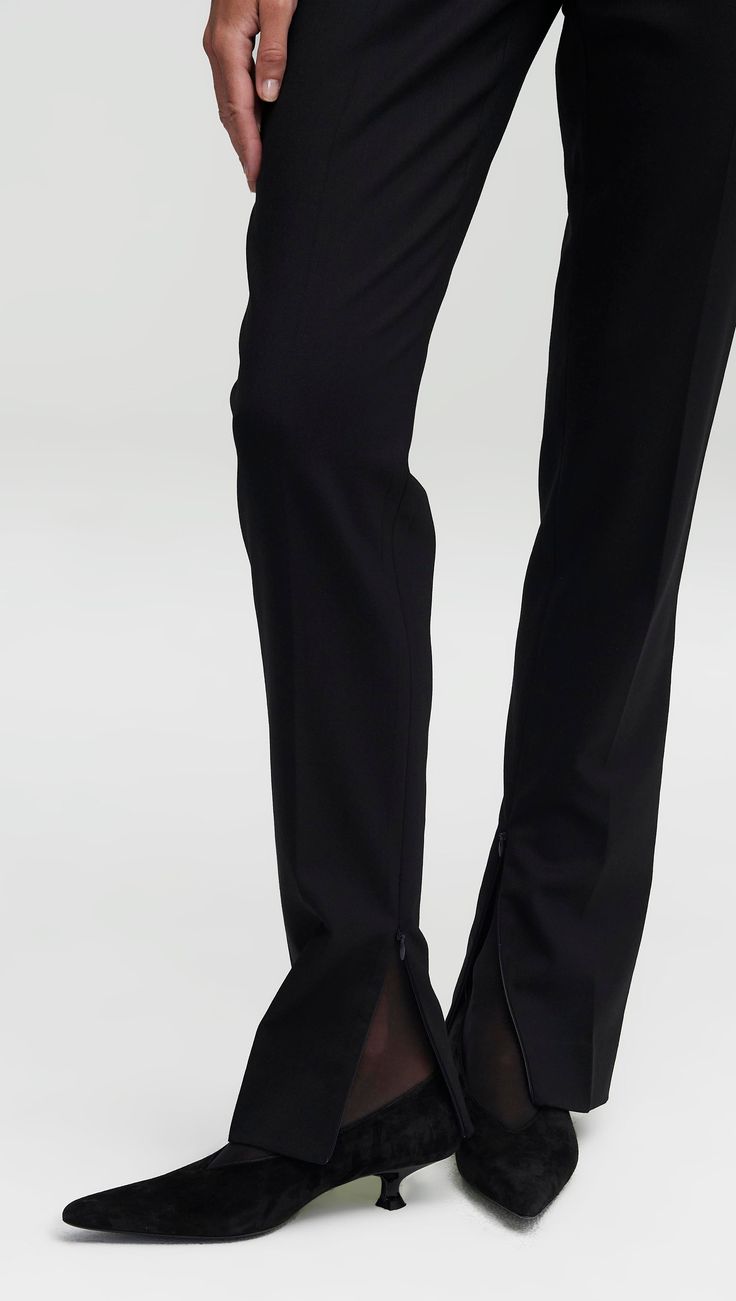 Made of a year-round, refined Italian stretch wool, this slim-fitting trouser features a contoured waistband and a full-length inseam with invisible zippers at the hem. The lightweight fabric is naturally temperature regulating and odor and wrinkle resistant. Functional details include a hidden exterior credit card pocket, front side pockets, and back welt pockets. Pairs well with the Single Button Blazer in Seasonless Wool. Elegant Formal Bottoms With Seam Detailing, Sleek Straight Silhouette Bottoms For Evening, Tailored Evening Dress Pants With Straight Silhouette, Tailored Straight Silhouette Dress Pants For Evening, Tailored Dress Pants For Evening With Straight Silhouette, Sleek Formal Dress Pants With Straight Silhouette, Elegant Formal Pants With Seam Detailing, Chic Formal Pants With Seam Detailing, Formal Stretch Dress Pants With Straight Silhouette