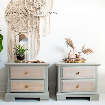 two nightstands side by side in front of a white wall with a macrame dream catcher hanging on it