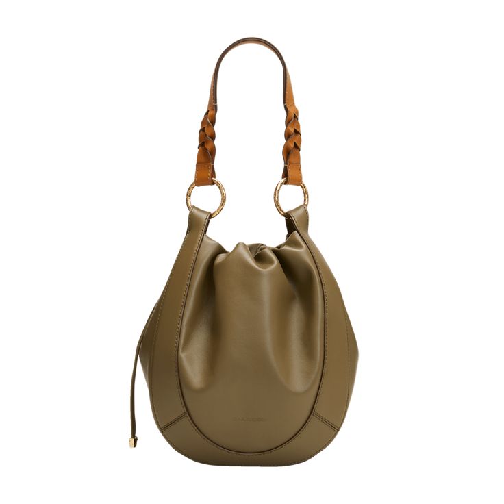 Ulla Johnson "Hilma" bucket bag in calf leather Flat top handles Removable, adjustable shoulder strap Drawstring closure  Interior, one slip pocket Approx. 10"H x 9"W x 4.8"D Professional cleaning recommended Made in Italy Luxury Bucket-shaped Hobo Bag With Handle Drop, Modern Bucket Hobo Bag With Gold-tone Hardware, Leather Bucket Shoulder Bag With Handle Drop, Leather Bucket Hobo Bag With Handle Drop, Leather Bucket Hobo Bag, Everyday Calf Leather Bucket Bag With Leather Handles, Modern Bucket Bag With Gold-tone Hardware In Calf Leather, Everyday Calf Leather Bucket Bag With Adjustable Strap, Leather Bucket Bag With Round Handle For Shopping